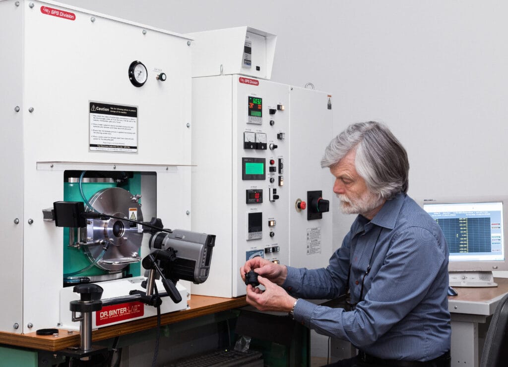 Kagaku Scientific founder Lars Hälldahl at a Spark Plasma Sintering system.
